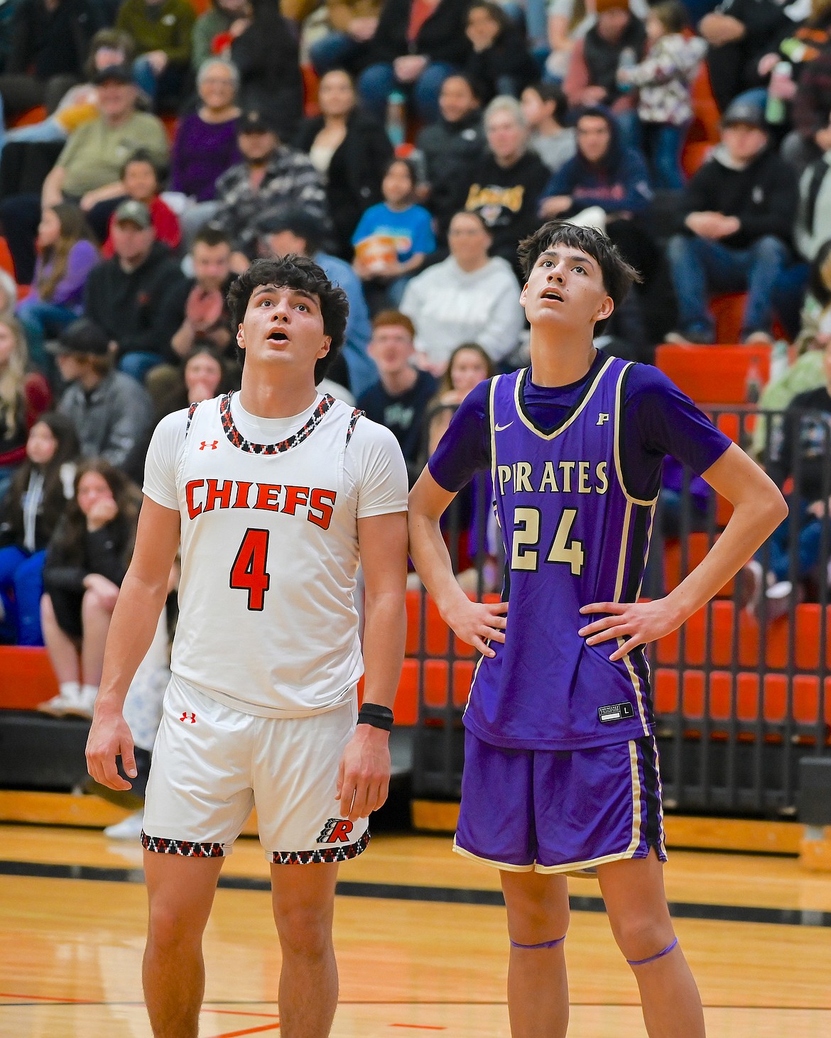 Ronan's Kolby Finley and Polson's Malakai Curley keep an eye on the ball during last week's game between the two schools. (Christa Umphrey photo)