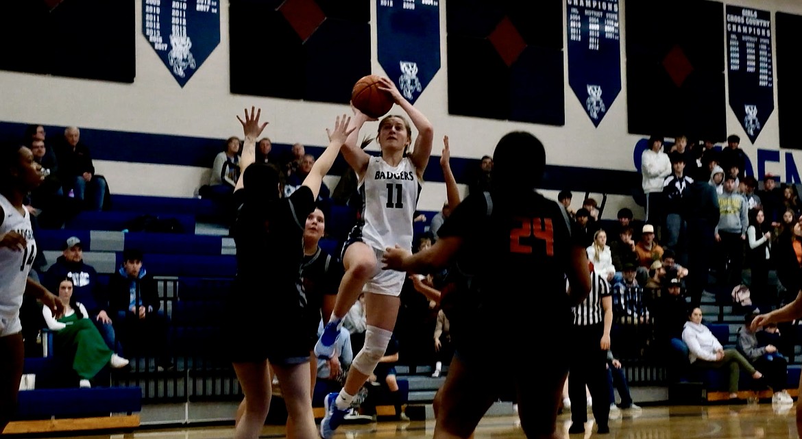 Taren Bateman hits a floater against Lake City on Jan. 30.