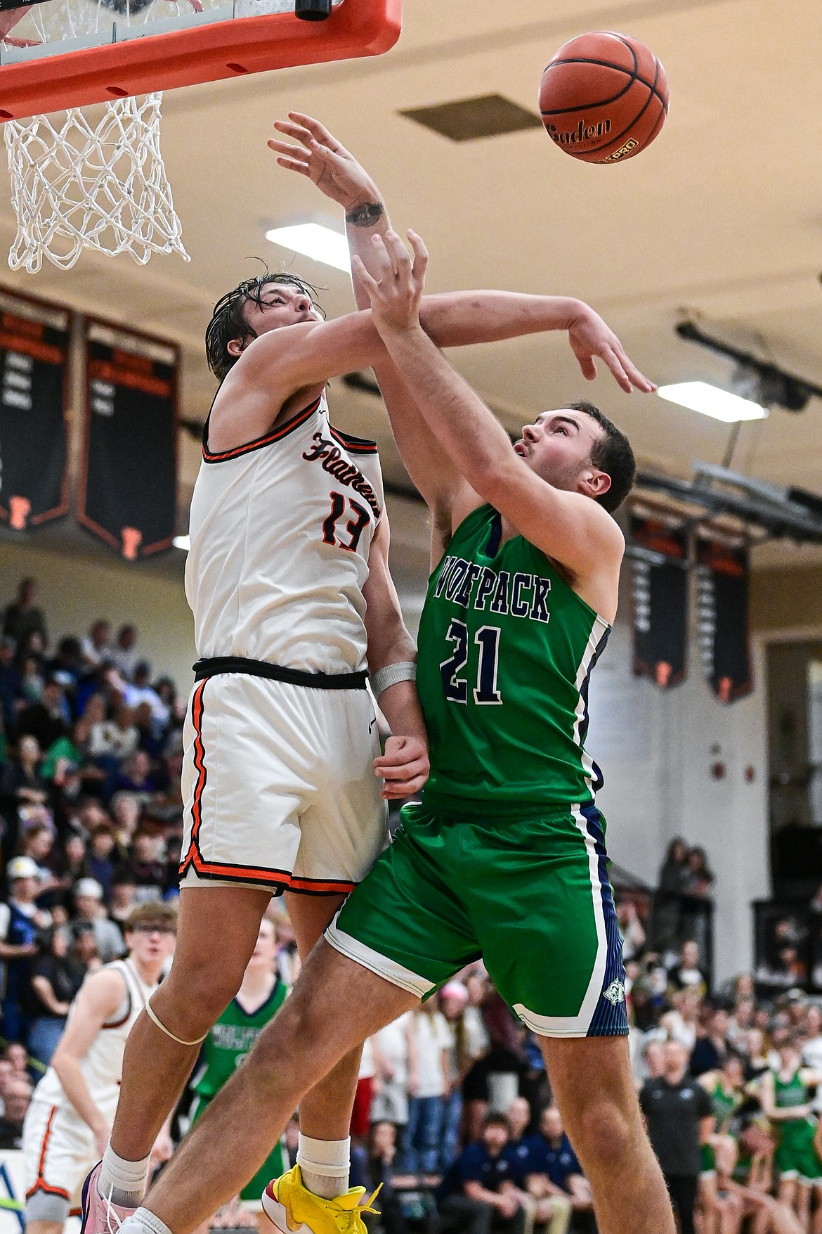 Flathead's Lyric Ersland (13) blocks a shot by Glacier's Slate Burrington (21) at Flathead High School on Thursday, Feb. 6. (Casey Kreider/Daily Inter Lake)