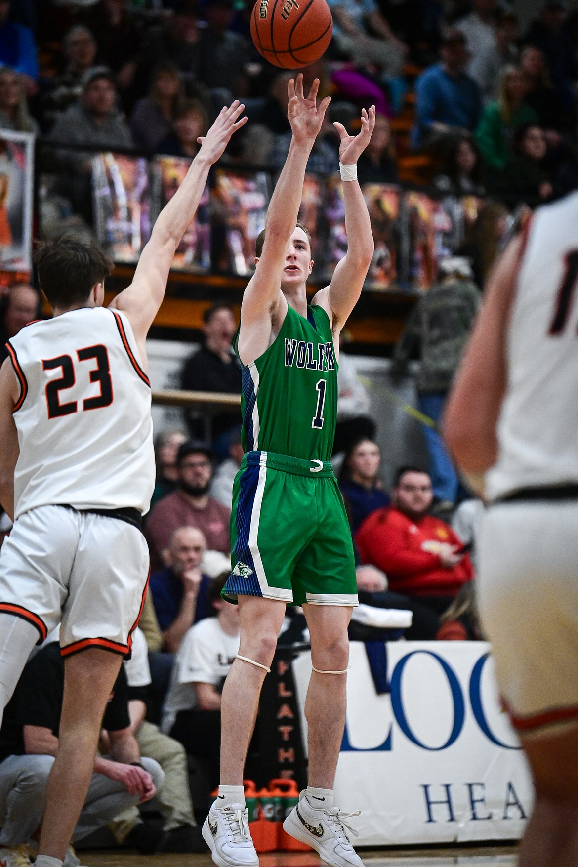 Glacier's Cooper Pelc (1) shoots a three in the first half against Flathead at Flathead High School on Thursday, Feb. 6. (Casey Kreider/Daily Inter Lake)