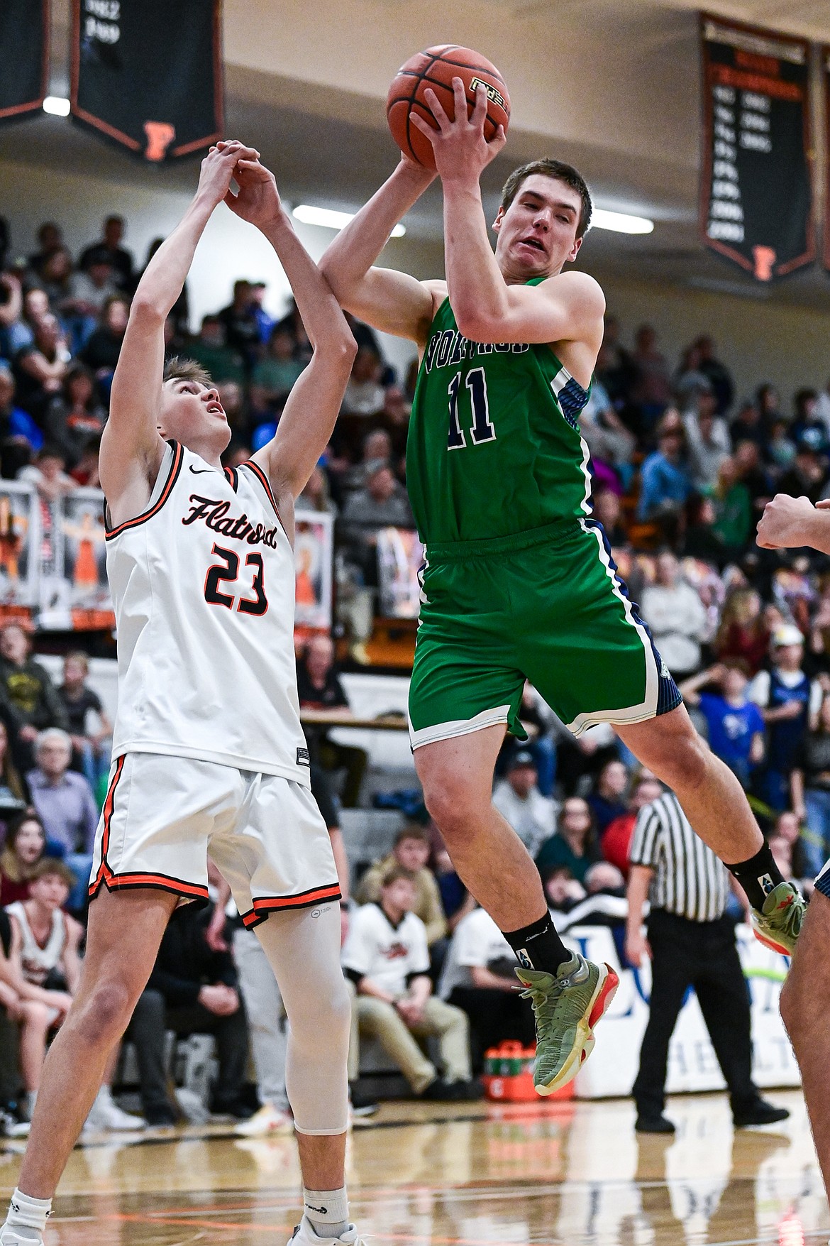Glacier's Asher Knopik (11) pulls down a rebound in the first half against Flathead at Flathead High School on Thursday, Feb. 6. (Casey Kreider/Daily Inter Lake)