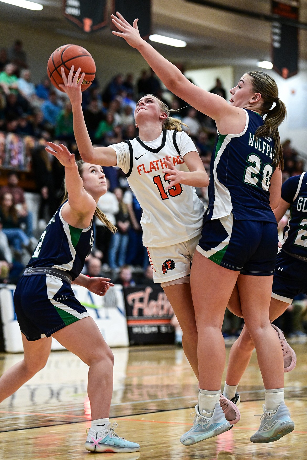 Flathead's Caitlin Converse (13) drives to the basket against Glacier at Flathead High School on Thursday, Feb. 6. (Casey Kreider/Daily Inter Lake)'