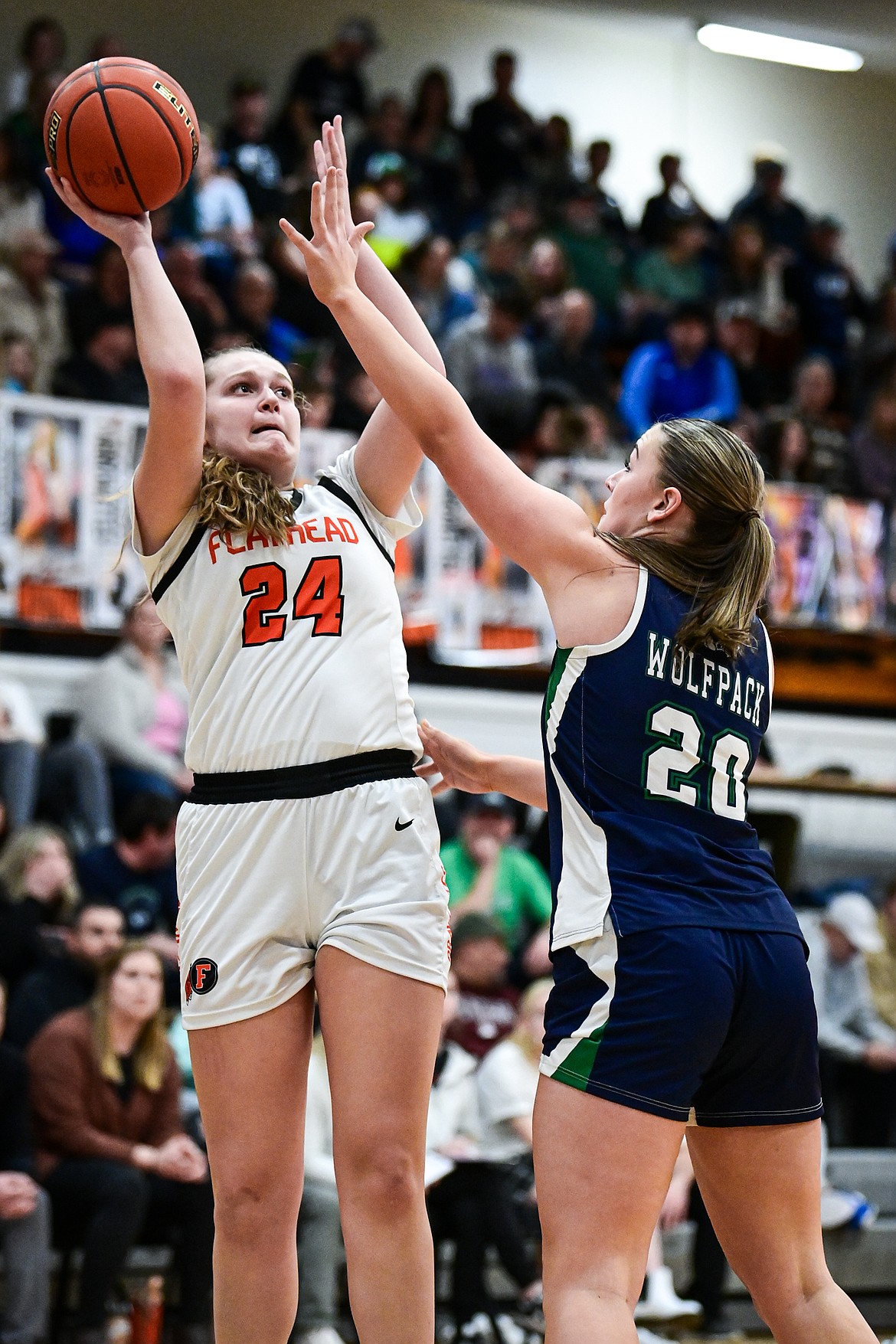 Flathead's Mattie Thompson (24) shoots over Glacier's Allie Krueger (20) at Flathead High School on Thursday, Feb. 6. (Casey Kreider/Daily Inter Lake)