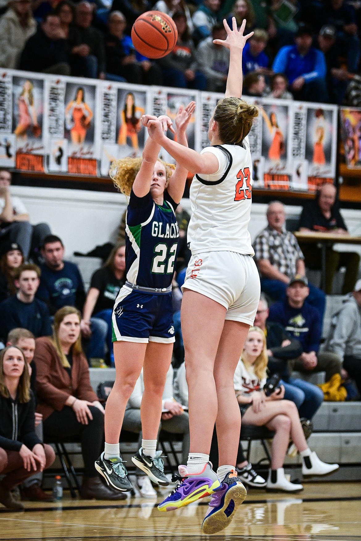 Glacier's Reese Ramey (22) shoots a three in the second quarter defended by Flathead's Grace Gall (23) at Flathead High School on Thursday, Feb. 6. (Casey Kreider/Daily Inter Lake)