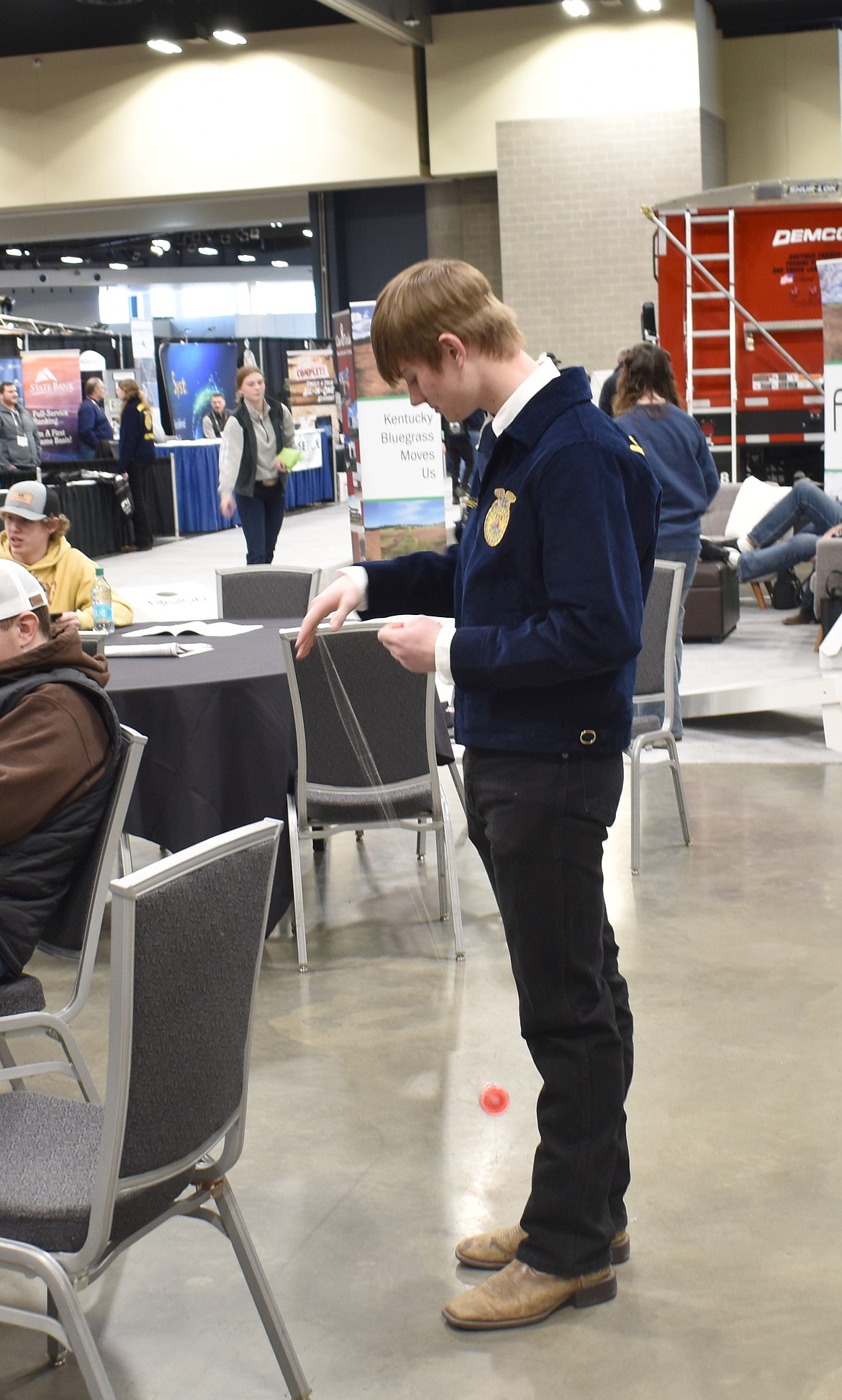 Jake Hone of LaCrosse tests out a yo-yo he picked up at a booth at the Spokane Ag Show.