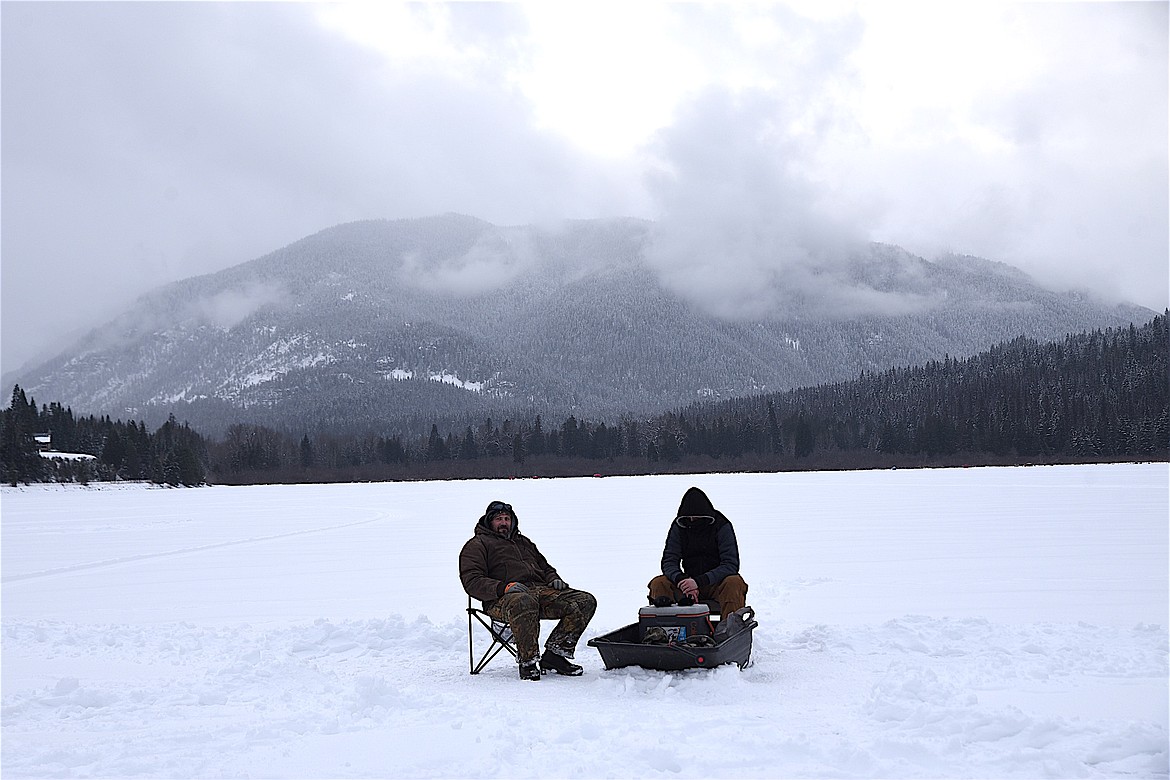 Trout Creek anglers Phil Salvatore, left, and Jessy Hill definitely enjoyed the quiet on Bull Lake, but hoped for the fishing action to pick up Sunday during the Halfway House Bar and Grill Ice Fishing Derby. Hill did land a 5-pound, 9-ounce northern Saturday. (Scott Shindledecker/The Western News)