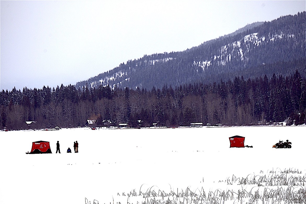 Ice fishing huts and ATVs dot the icy surface on Bull Lake Saturday, Feb. 8, 2025, during the Halfway House Bar and Grill Ice Fishing Derby. (Scott Shindledecker/The Western News)