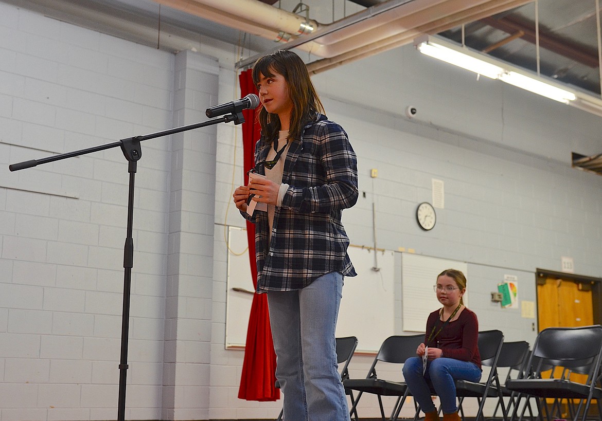 Sixth grader Apollonia Hail of Charlo, last year's champion speller, finished second in this year's county bee. The eventual winner, Heidi Huber, waits her turn. (Kristi Niemeyer/Leader)