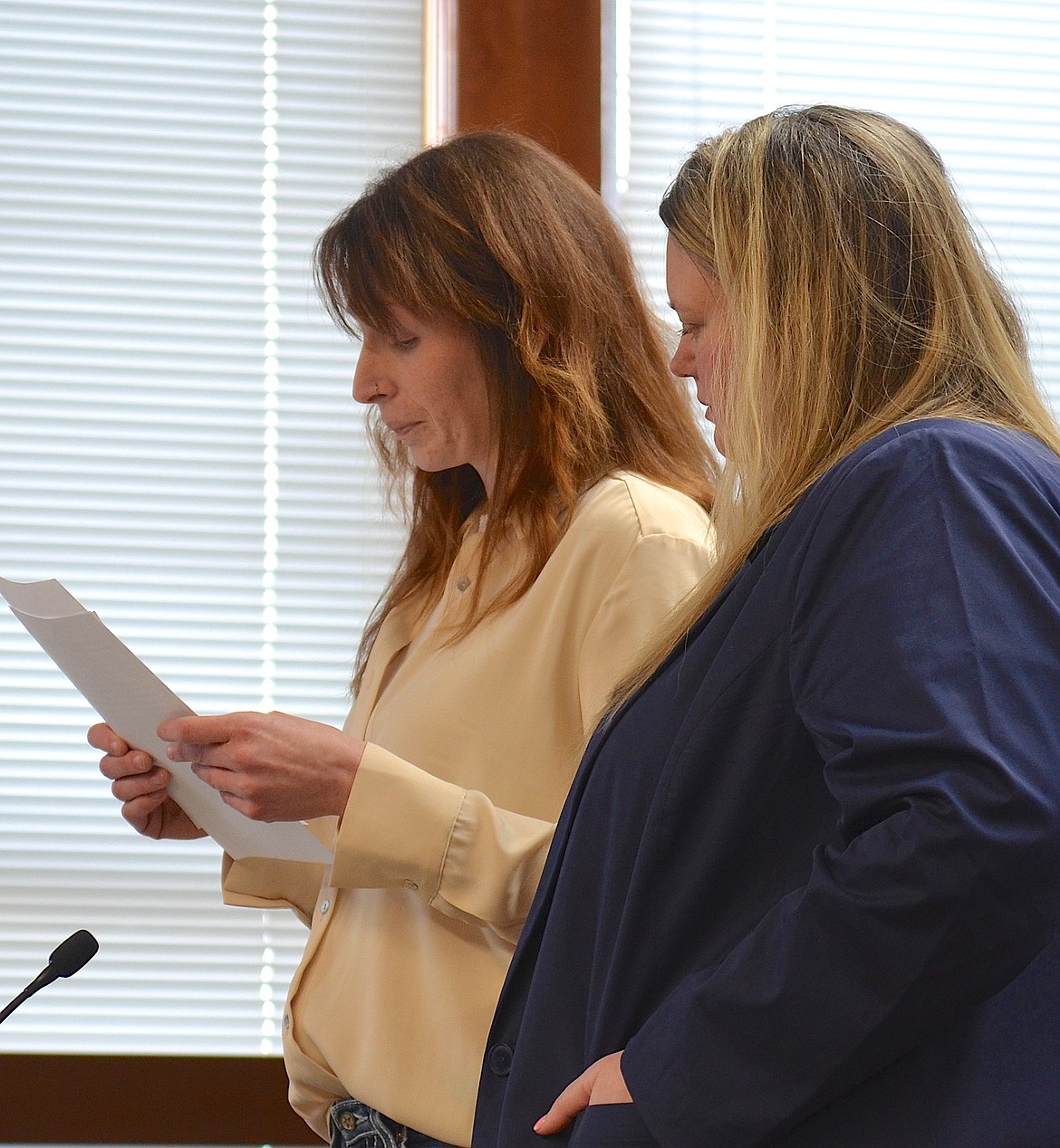 Sunny White, standing next to her attorney, Meghan Benson, reads from a statement during her sentencing hearing last Friday at the Lake County Courthouse. (Kristi Niemeyer/Leader)