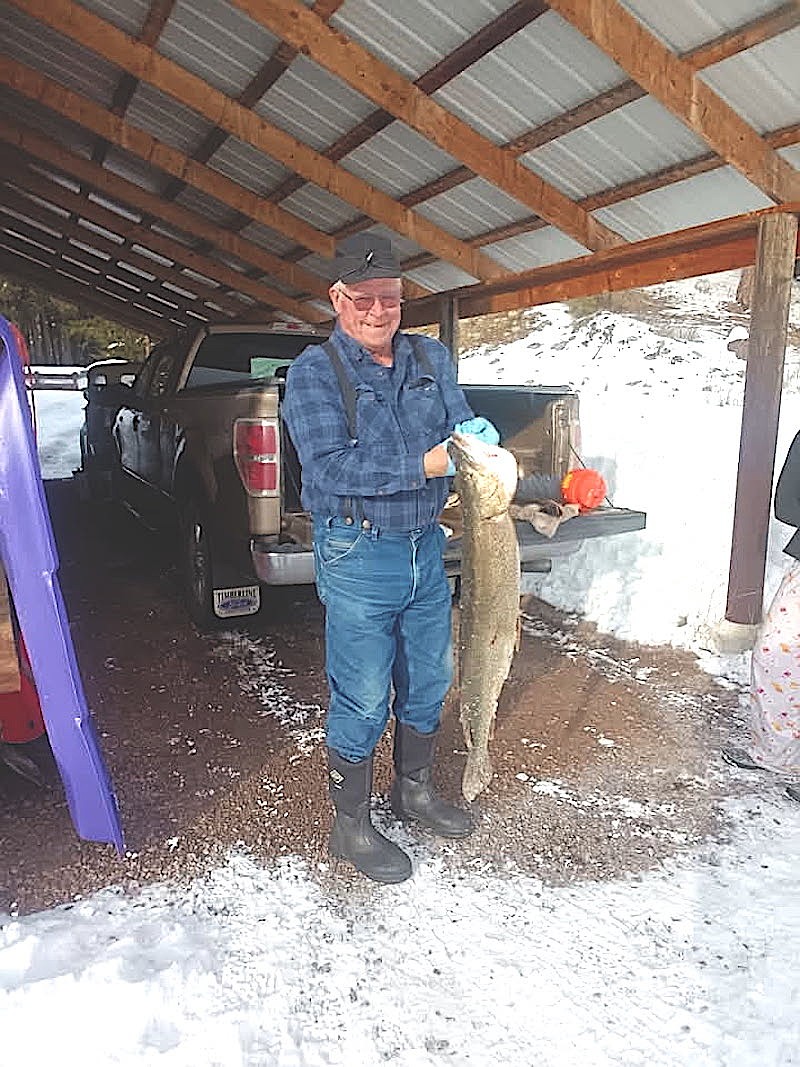 Libby's Drew Munro shows off the 17 pound, four ounce northern pike he caught in Bull Lake last weekend during the Halfway House Bar and Grill's Ice Fishing Derby. (Courtesy photo)