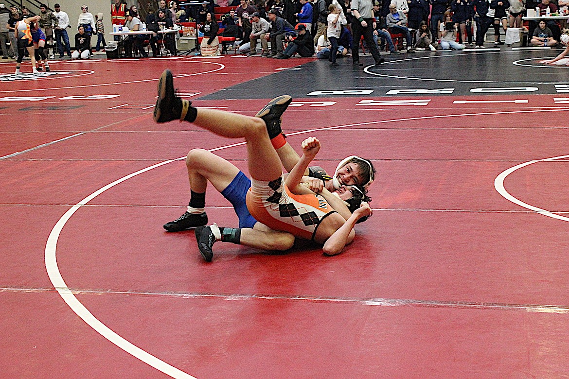 Libby Greenchain's Riley Orr is also smiles as he locks up a cradle last weekend at the Western A Divisional boys wrestling tournament in Browning. (Photo courtesy Don Madison)