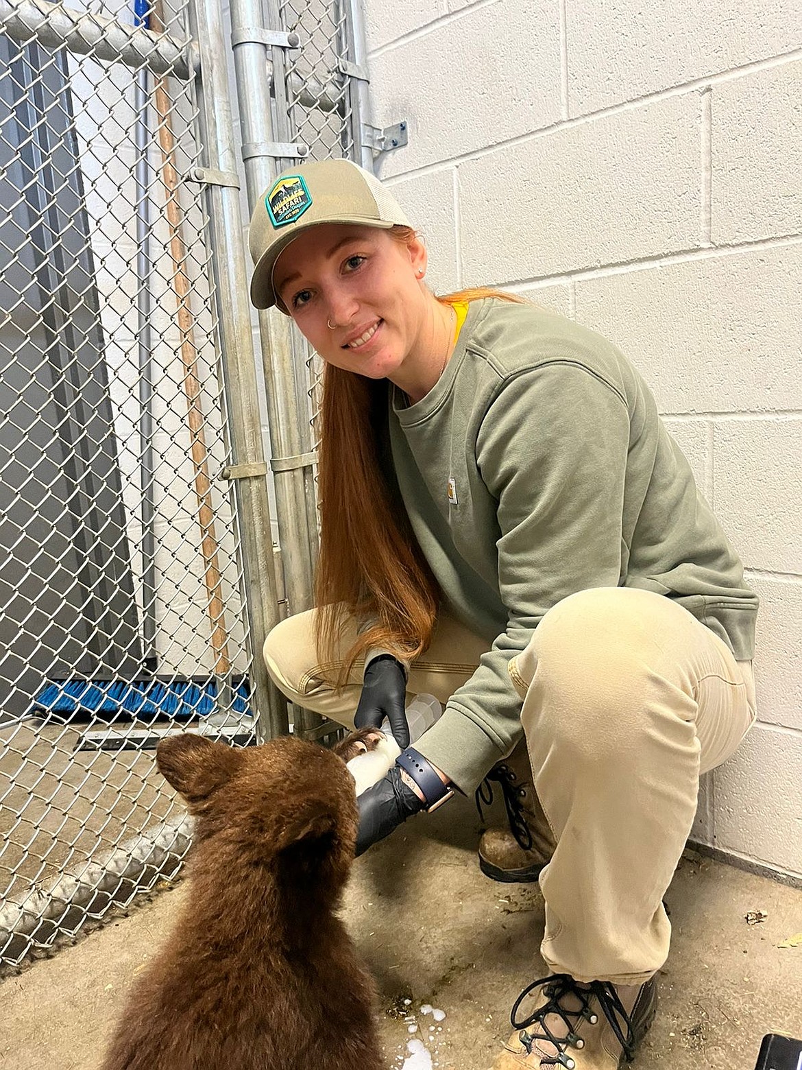 Former Superior Bobcat, Kenzie Stager-Staats is now a Doctor of Veterinary Medicine. Here she is bottle feeding a bear cub. (Photo Courtesy/Kenzie Stager-Staats)