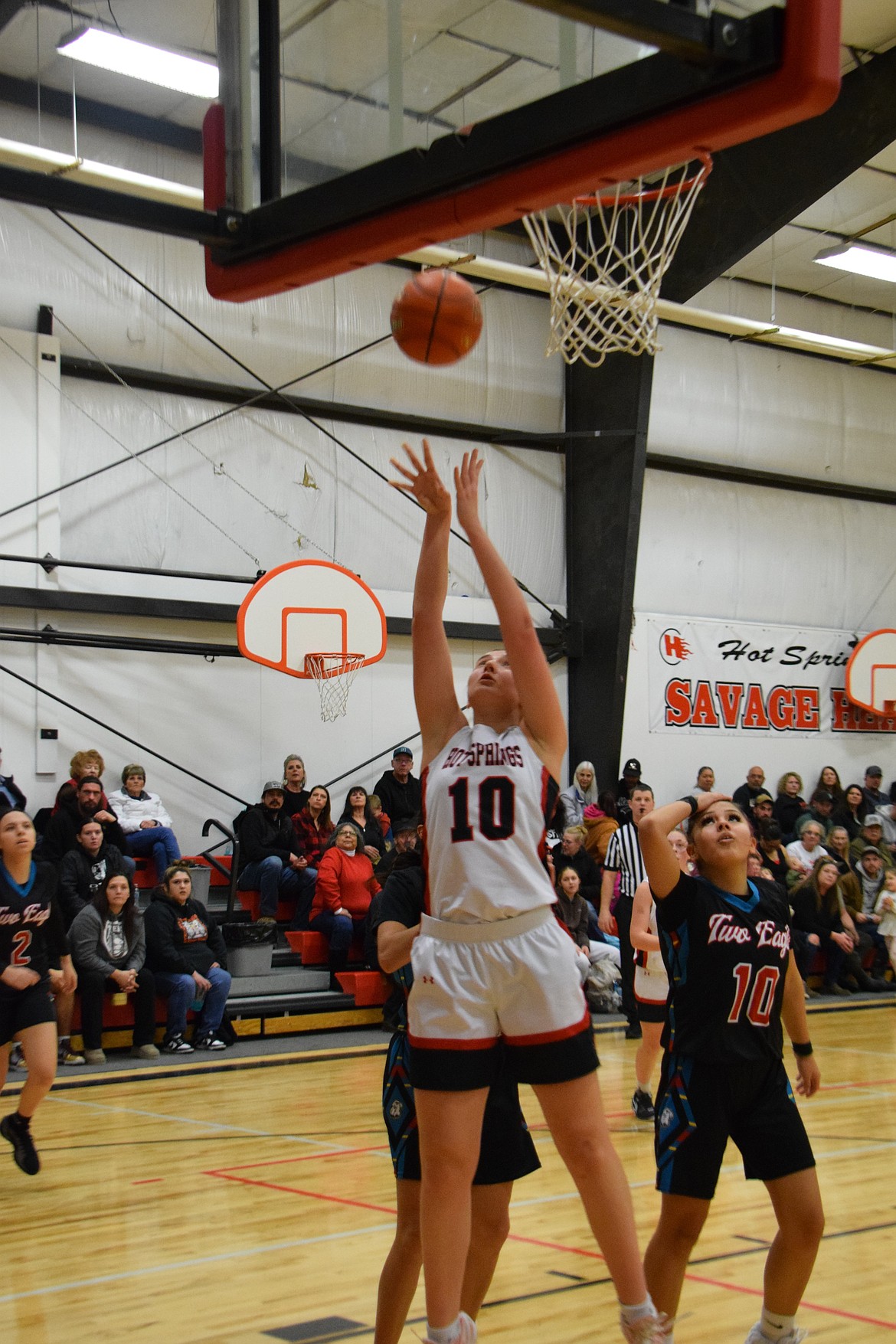 Hot Springs junior Lilia Sapanel, a French foreign exchange student, goes up for two during the Lady Heat's win over Two Eagles River this past Thursday in Hot Springs. (Photo by Jen Christensen)