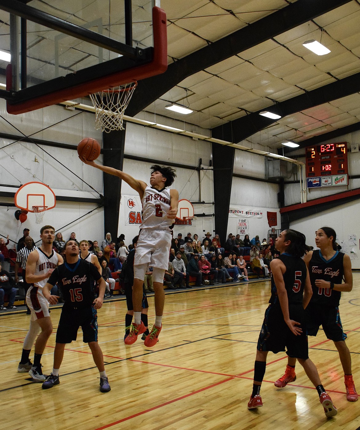 Senior guard Wesley Adams goes to the hoop for two points during Hot Springs' game against Two Eagle River this past Thursday in Hot Springs.  (Photo by Jen Christensen)