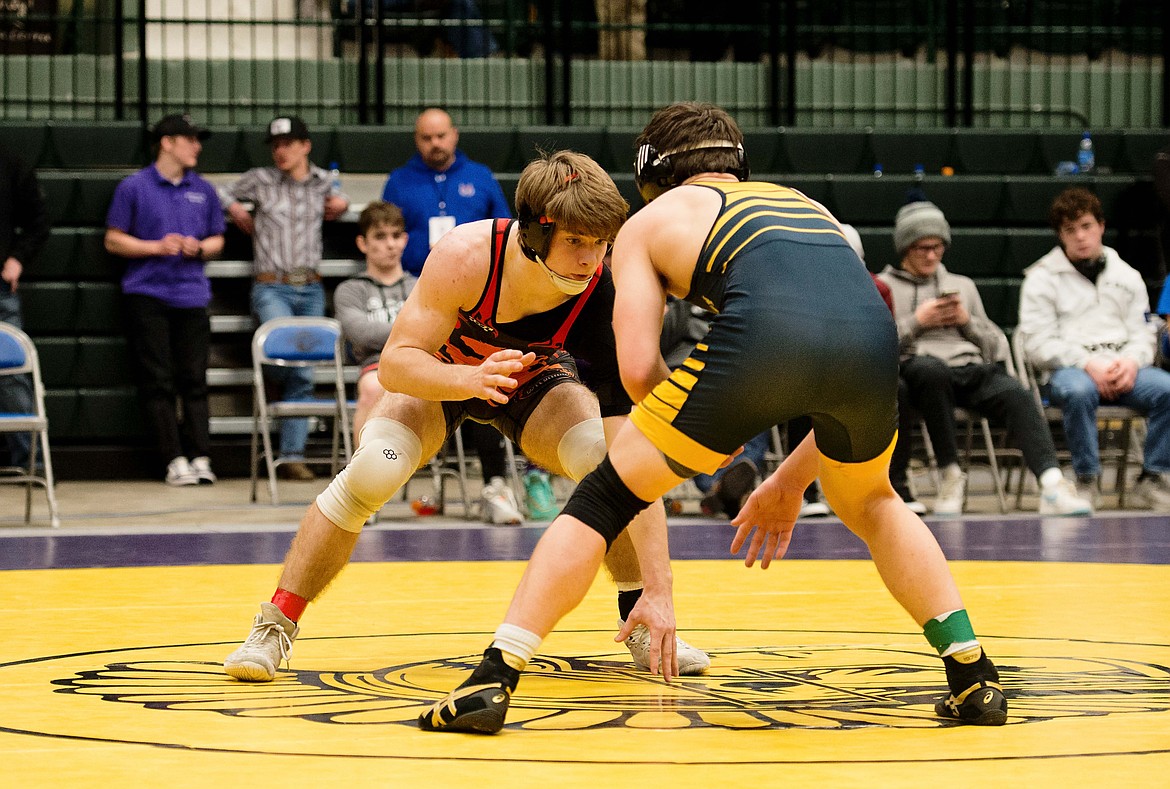 Plains-Hot Springs wrestler Joh Waterbury (left) moves in for a take down during a 157-pound match at the Western Divisional wrestling tournament in Butte this past weekend. (Photo by Tracy Waterbury)