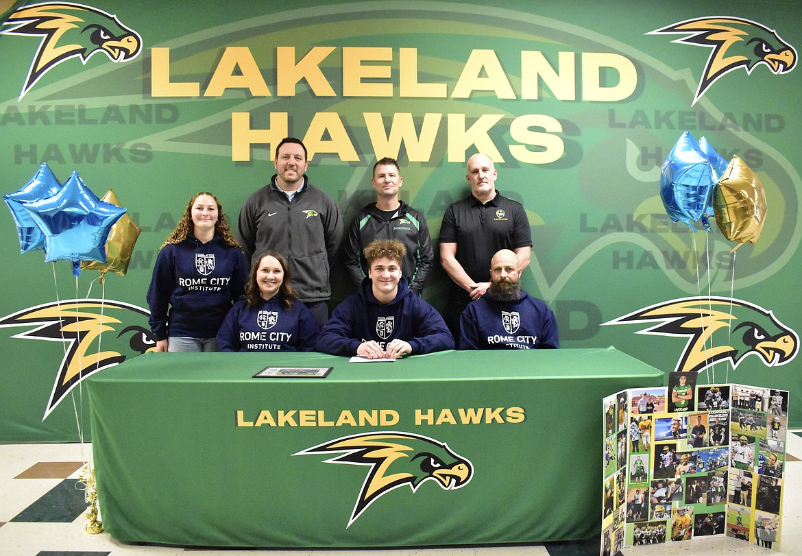 Courtesy photo
Lakeland High senior Terry Davis is headed to Rome, Italy, to play football at the Rome City Institute. Seated from left are Jenna Davis (mom), Terry Davis and Brian Davis (dad); and standing from left, Reagan Davis (sister), Jimmy Hoffman (principal), Matt Neff (athletic director) and Tim Kiefer (football coach).