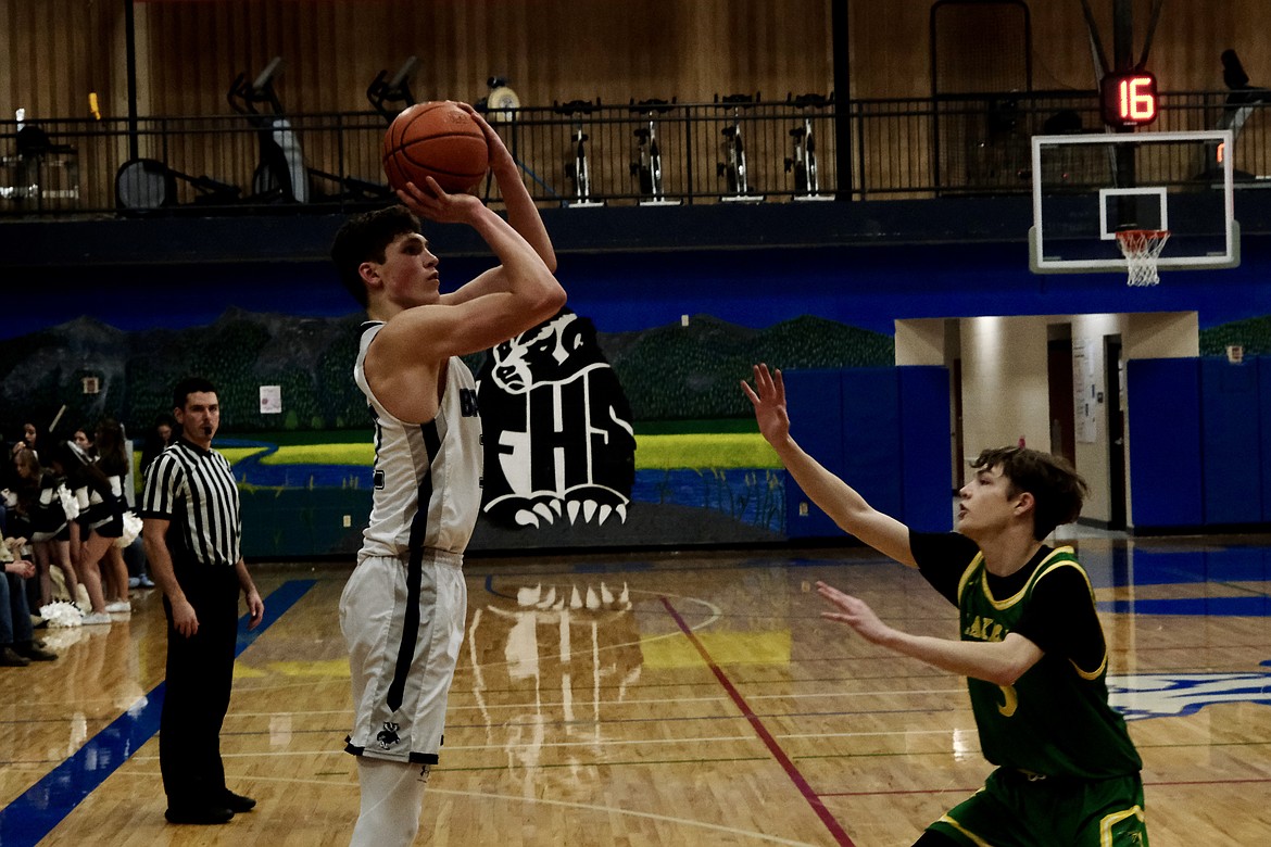 Senior Asher Williams hits a jumper in a win earlier this season. Williams now ranks in the top 10 in all time points scored by Idaho high schoolers.