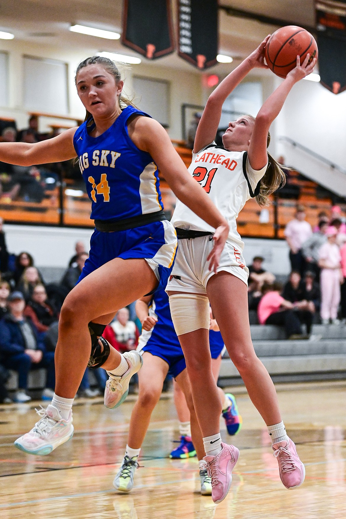 Flathead's Ava Malmin (21) drives to the basket in the second quarter against Missoula Big Sky at Flathead HIgh School on Thursday, Feb. 13. (Casey Kreider/Daily Inter Lake)