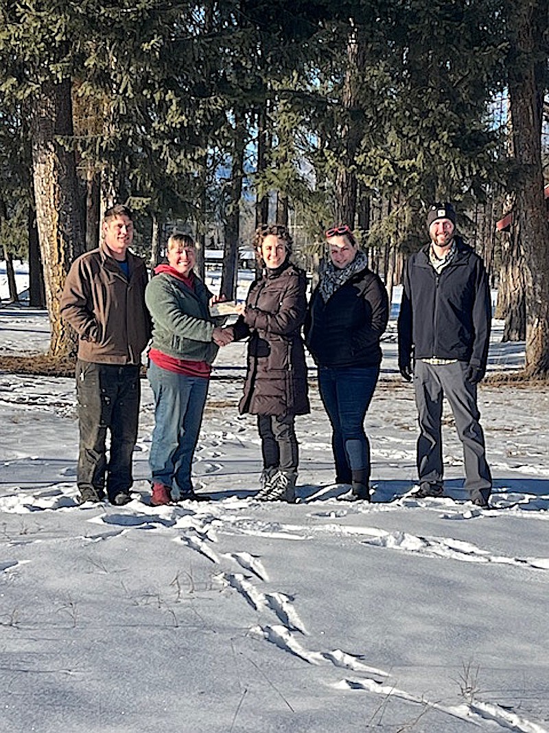 The Kootenai River Development Council recently voted unanimously to grant $10,000 to the new 501c3 nonprofit entity, The Farmers Market at Libby. This significant gift will cover some of the additional costs of doing business as the market has formed an independent corporation outside of the Chamber of Commerce, where it operated for six seasons. Members of KRDC and the Farmers Market Boards met at the newly announced Farmers Market location on the corner of Highway 2 and Idaho in front of the Asa Wood building. This new location was the result of a generous offer from property owner, Chris Noble of Noble Excavating. With the new Farmers Market season beginning on May 1, market organizers, vendors and customers are looking forward to seeing positive growth for this year. Farmers Market Board Members Brandon Haugen and Bonnie Geber accept a $10,000 grant from KRDC Board Members, Kristin Smith, Jennifer McCully and Nick Raines at the newly announced location for the Farmers Market in front of the Asa Wood building. (Courtesy photo)