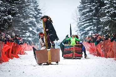 Participants race down Sugar Hill at the Barstool Ski Races at Cabin Fever Days in Martin City on Saturday, Feb. 15. (Casey Kreider/Daily Inter Lake)