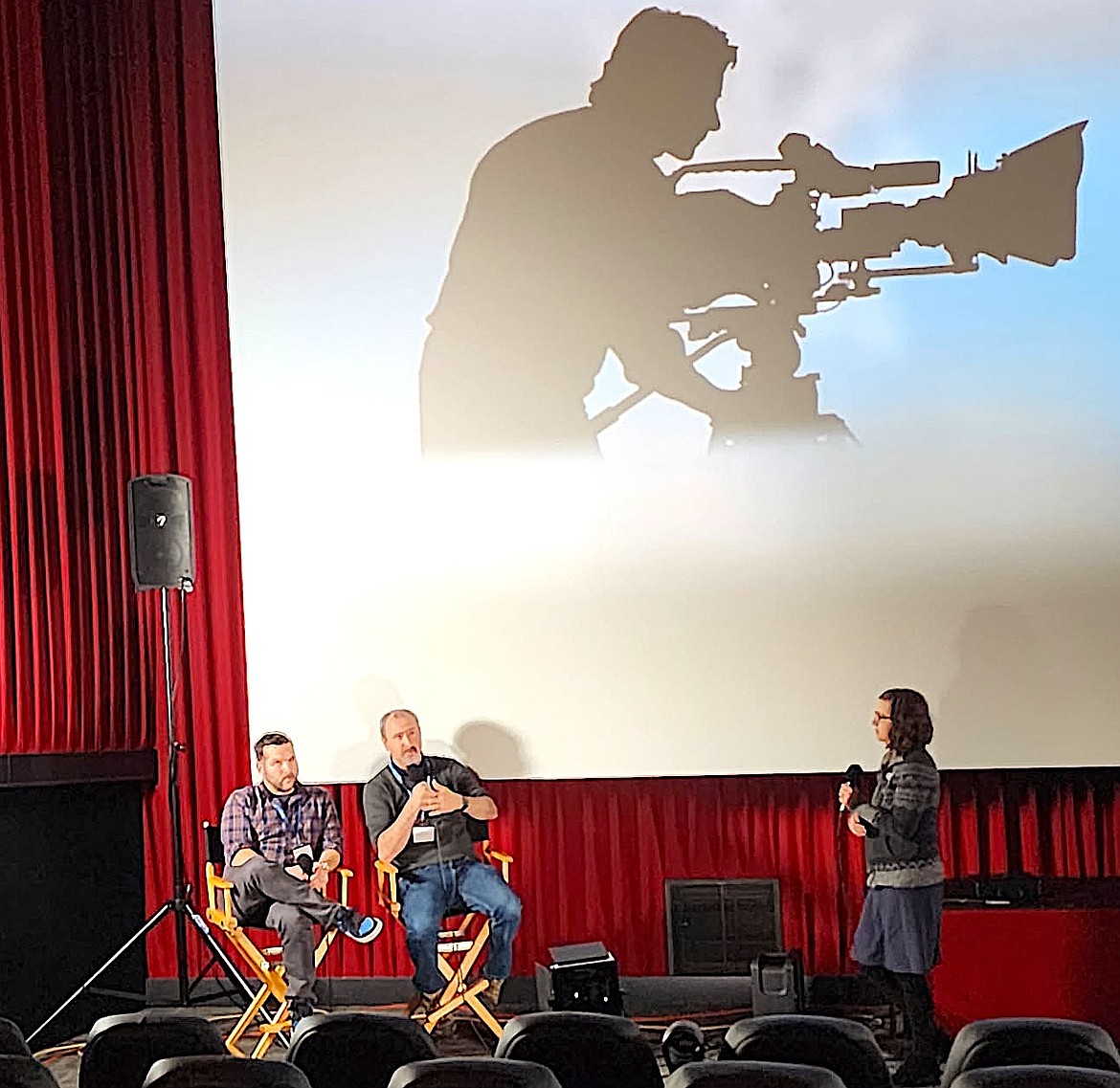 FLIC producer David King helps Nnamdi Kanaga who wrote, directed, and co-produced "Water Girl", arrange his awards for a photo. "Water Girl" won Best Picture--Feature, Best Original Score, and Best Actress at the film festival. (Berl Tiskus/:eader)