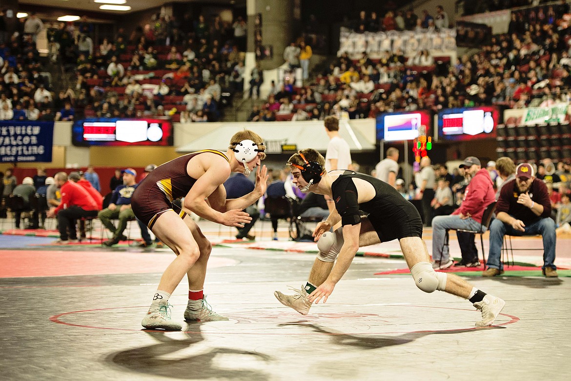 Plains-Hot Springs 157-pounder John Waterbury (right) goes in for a takedown against an opponent at the State wrestling championships in Billings this past weekend.  (Photo by Teresa Waterbury)