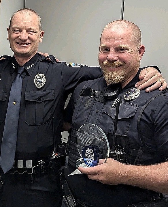 Polson Chief George Simpson with Officer Michael Wharton, celebrating his 20th year in law enforcement last summer.