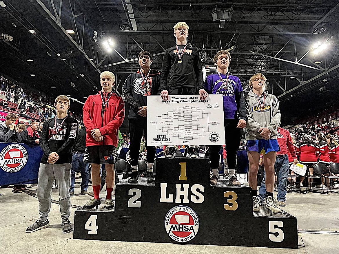 Libby Greenchain wrestler Boe Miles, far right, shows off his medal Saturday, Feb. 15, 2025, for placing fifth in the 150-pound weight class at the Montana High School Association Class A Championships at MetraPark in Billings. (Photo courtesy Don Madison)