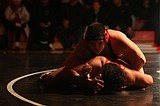 Huskies wrestlers work to achieve lofty goals in Tacoma