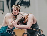 PREP DISTRICT WRESTLING TOURNAMENTS: Trojans take 11th straight district title