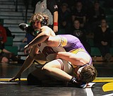 PREP BOYS WRESTLING: Tyler, Holman repeat as district champions