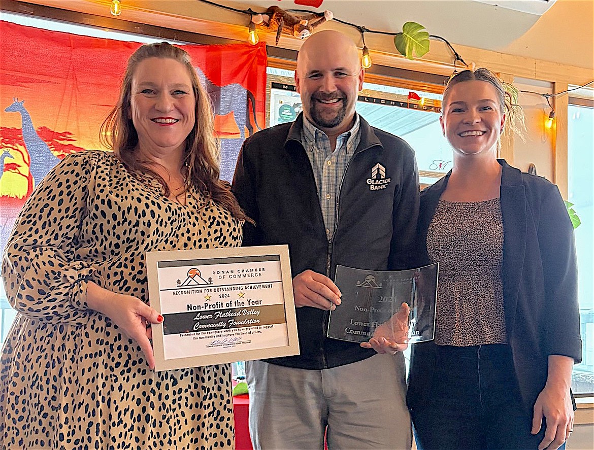 Brennin Grainey (center) receives the award for Non-Profit of the Year on behalf of the Lower Flathead Valley Community Foundation, flanked by Ronan Chamber manager Tammy Campbell and Chamber President Katie Jo Elliott. (Courtesy photo)