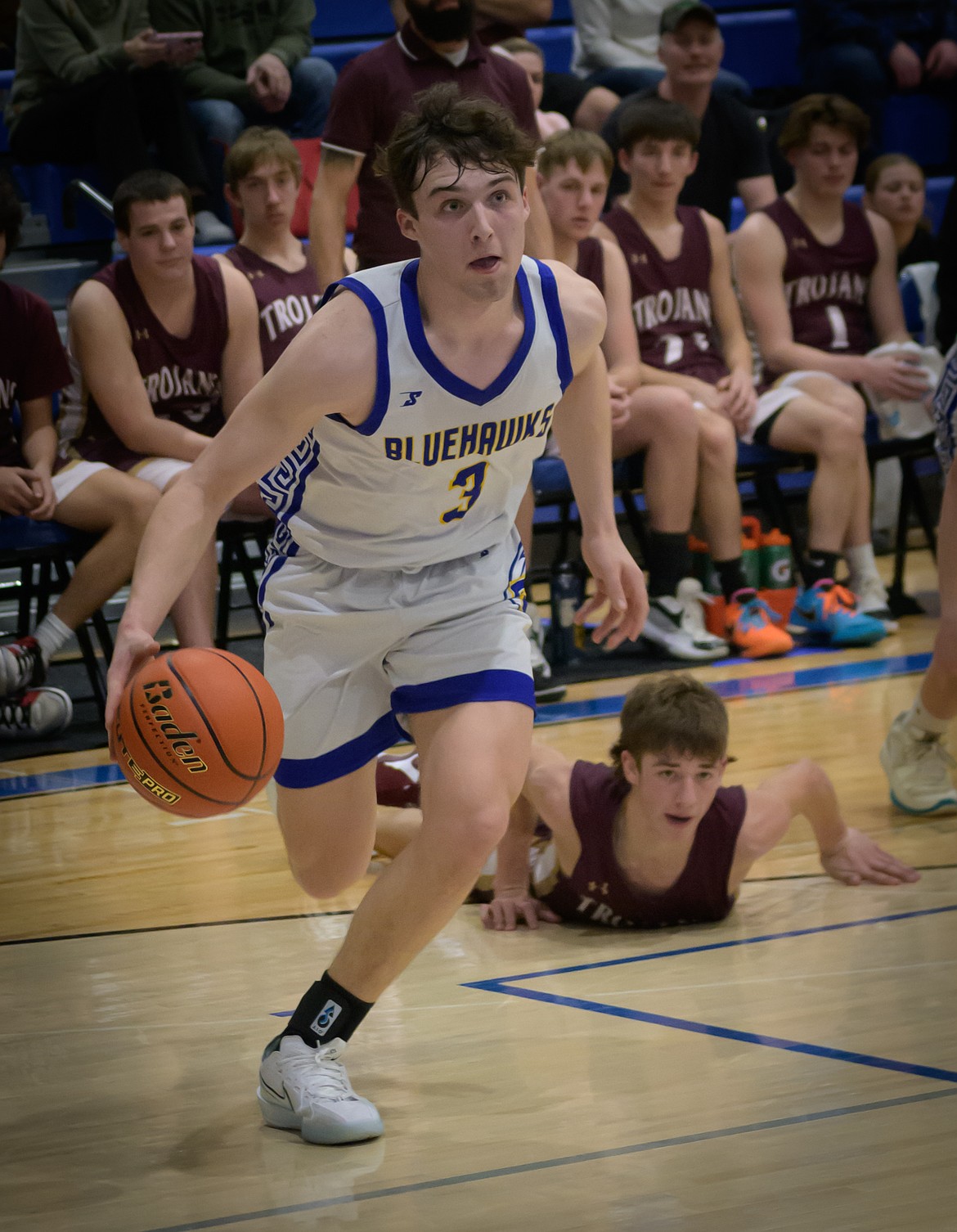 Thompson Falls senior forward Bryson LeCoure breaks for the basket during the Blue Hawk championship run in the Western 7B district tournament this past week in St. Ignatius. (Tracy Scott/Valley Press)