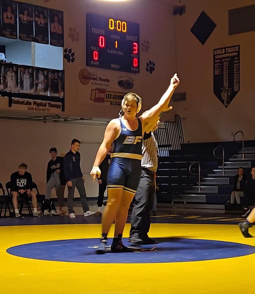 Bonners Ferry High sophomore Taylor Dodd has his hand raised after pinning Timberlake High sophomore Archer Higgins to win the 285-pound weight class at 4A District 1-2 Championships held this past Friday, Feb. 21 at Timberlake High.