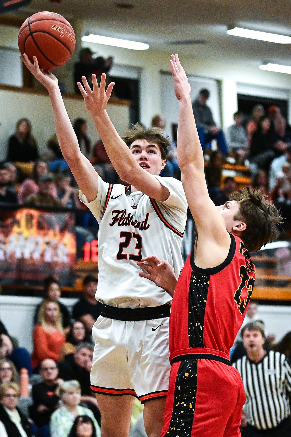 Flathead's Noah Sonju (23) shoots in the first quarter against Missoula Hellgate at Flathead High School on Thursday, Feb. 27. (Casey Kreider/Daily Inter Lake)