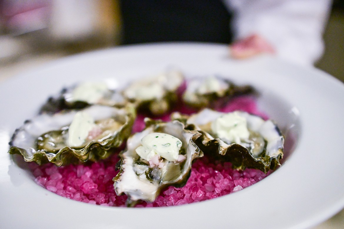 Oysters on the half shell from Totten, Washington, served with a shallot mignonette and chive creme fresh at a Chef's Table dinner series held by Flathead Valley Community College's Culinary Institue of Montana on Friday, Feb. 21. (Casey Kreider/Daily Inter Lake)