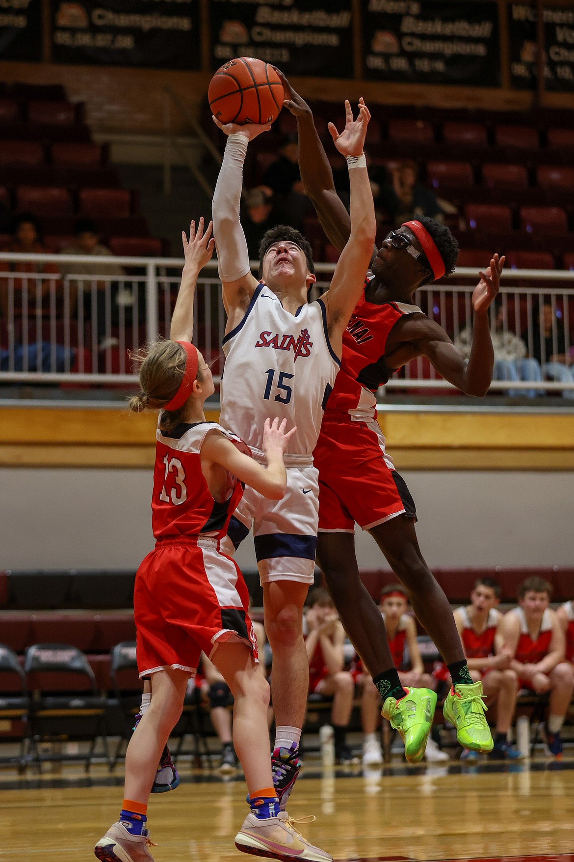 JASON DUCHOW PHOTOGRAPHY
Christopher Moore of Kootenai blocks a shot by Greg Hayes (15) of Coeur du Christ during the 1A District 1 championship game Thursday at North Idaho College.