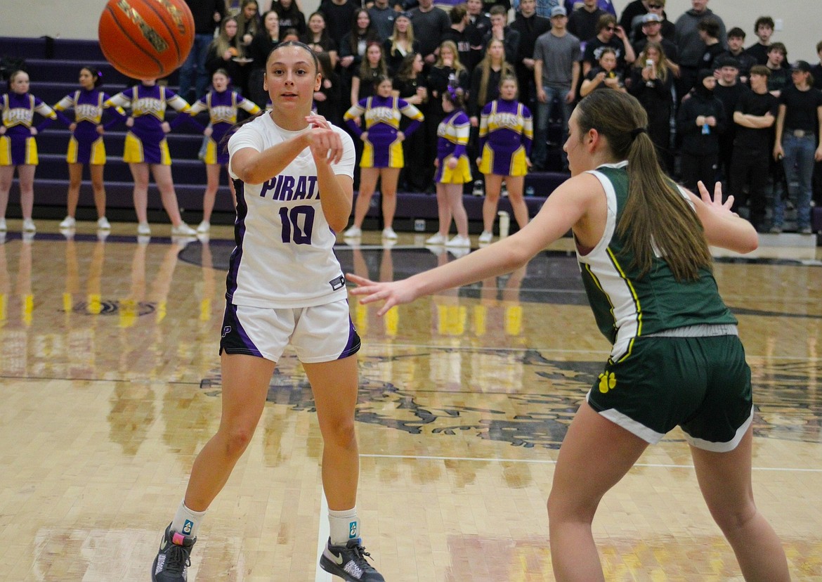 Polson's Samantha Rensvold passes to a teammate against a Whitefish defender. (Kaleb Unger/Leader)