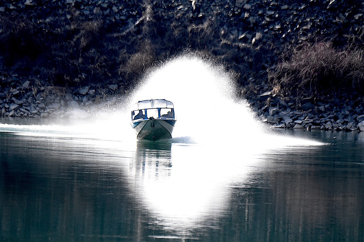 A boater speeds down the Kootenai River Sunday, March 2, 2025, near the Yaak River Campground boat launch. (Scott Shindledecker/The Western News)