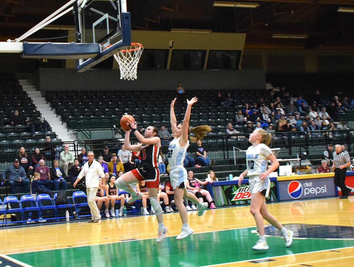 Junior guard Kara Christensen goes up for two during Hot Springs' playoff game at the Western C Divisional tourney this past weekend in Butte.  (Photo by Jen Christensen)