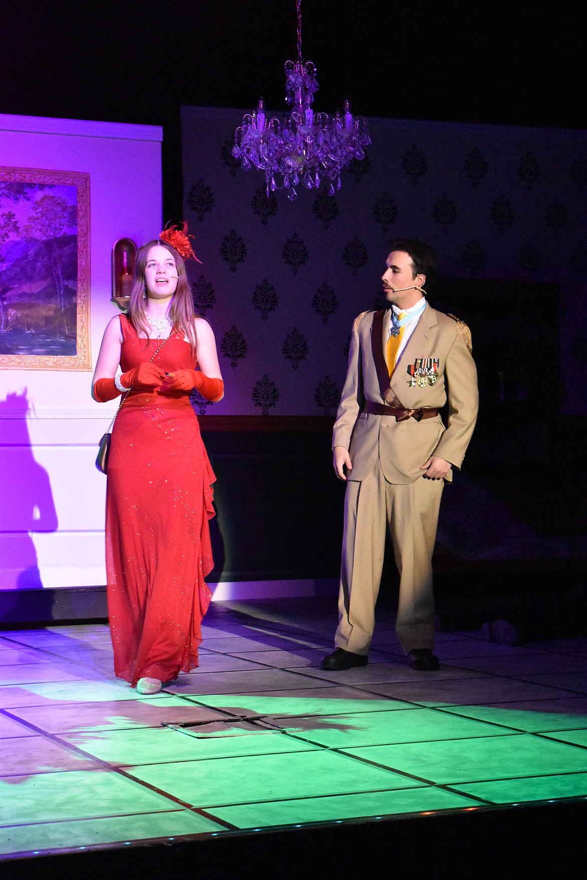 Miss Scarlet (Paisley Ashton, left) and Col. Mustard (Damian Gonzalez) find themselves in a secret passage.