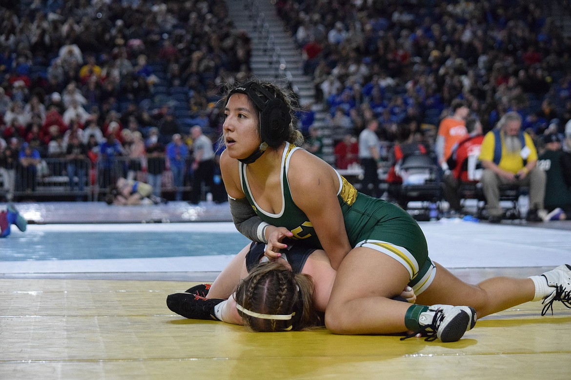 Crystal Vargas, 120 of Quincy wrestles Romana Reinitz of Centralia. Vargas lost the bout but came back in cons and one a match.