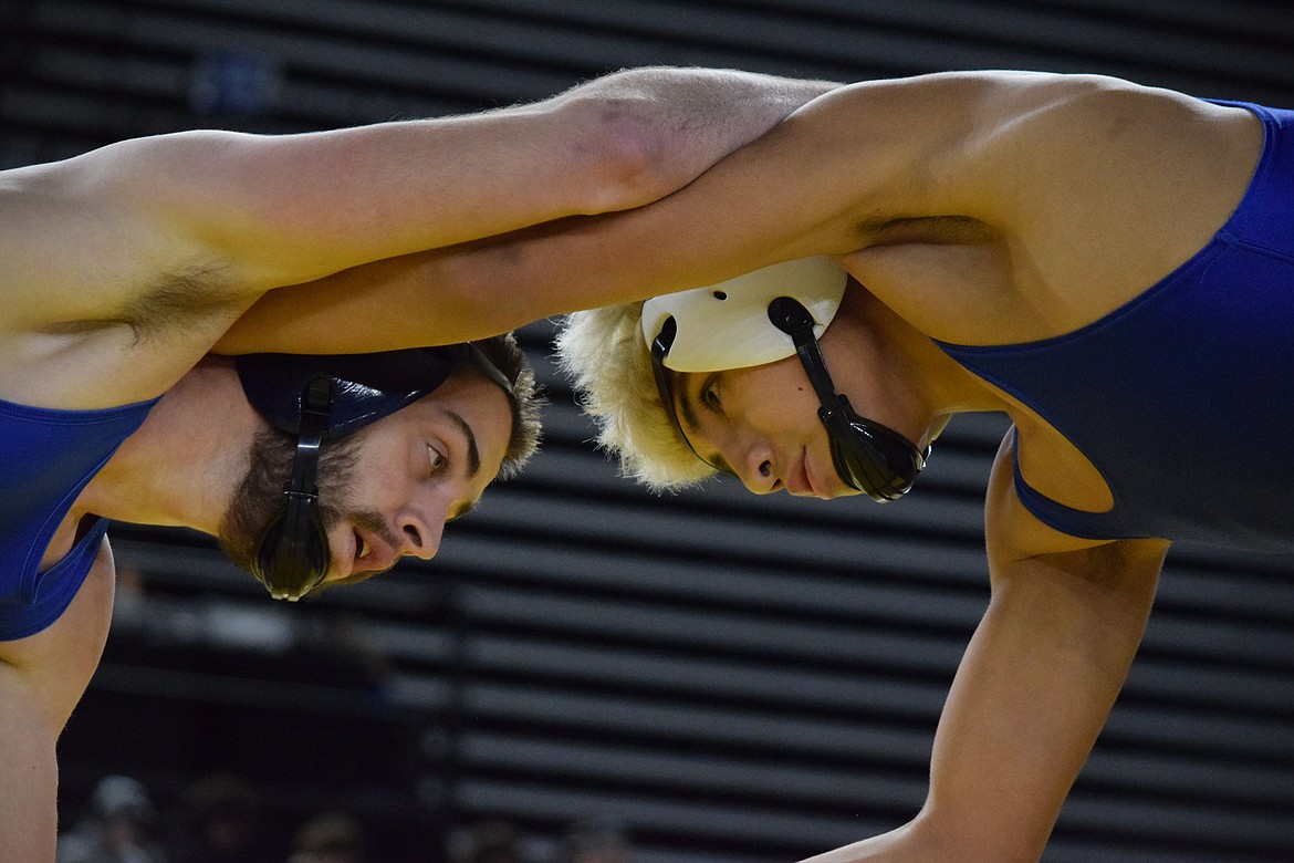 Junior Santiago, 144, of Warden wrestles Keenean Denison of Tonasket during round two of championships. Denison took the match. However, Santiago returned in cons and placed sixth in the tournament with 16 points.