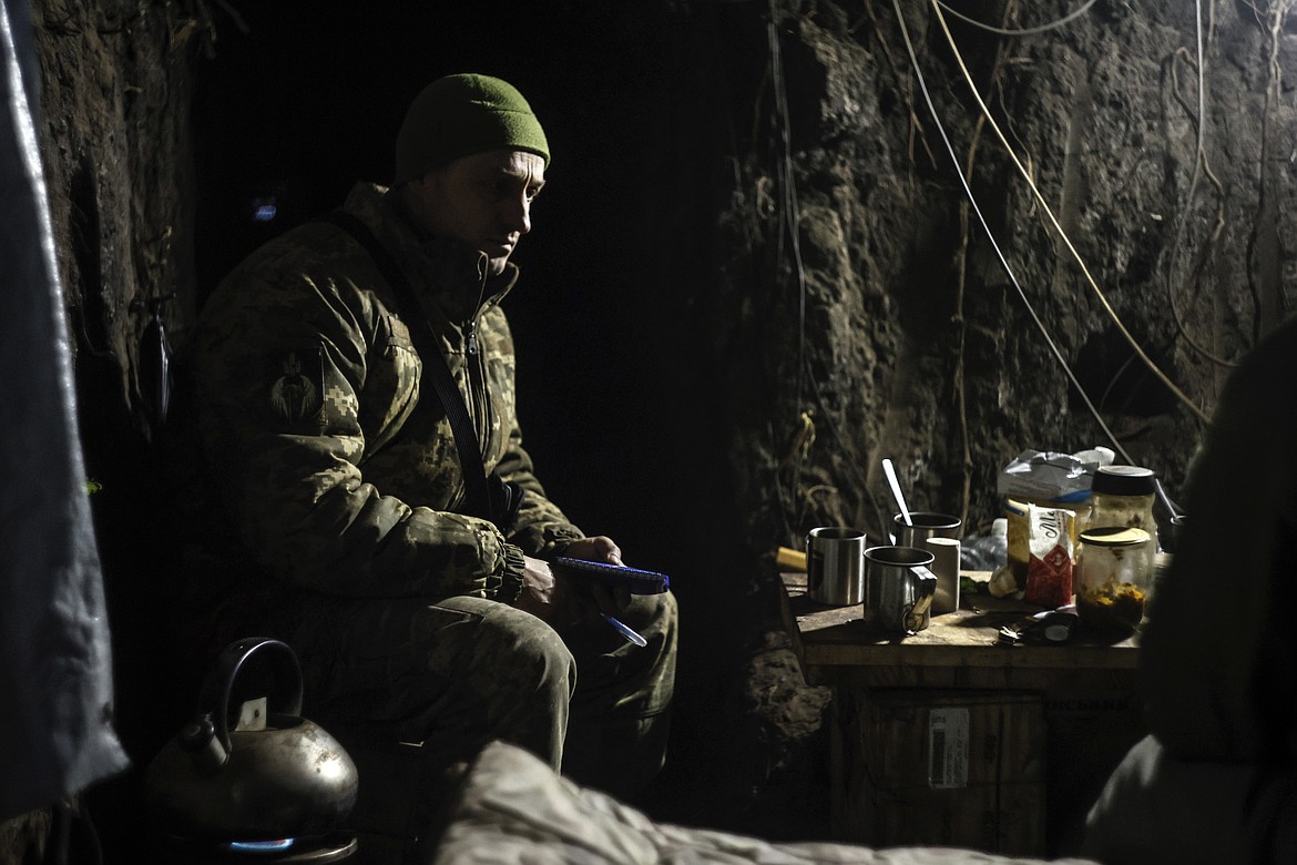 A Ukrainian serviceman sits in a shelter on his position at the frontline near Donetsk, Ukraine, Monday, March 3, 2025. (AP Photo/Roman Chop)