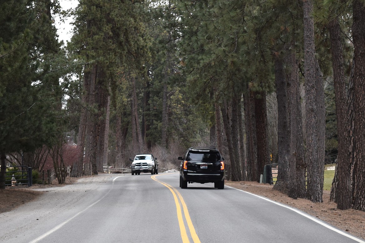 Cars travel along what could become a one-way section of Lakeview Drive in Hayden Lake on Tuesday evening.