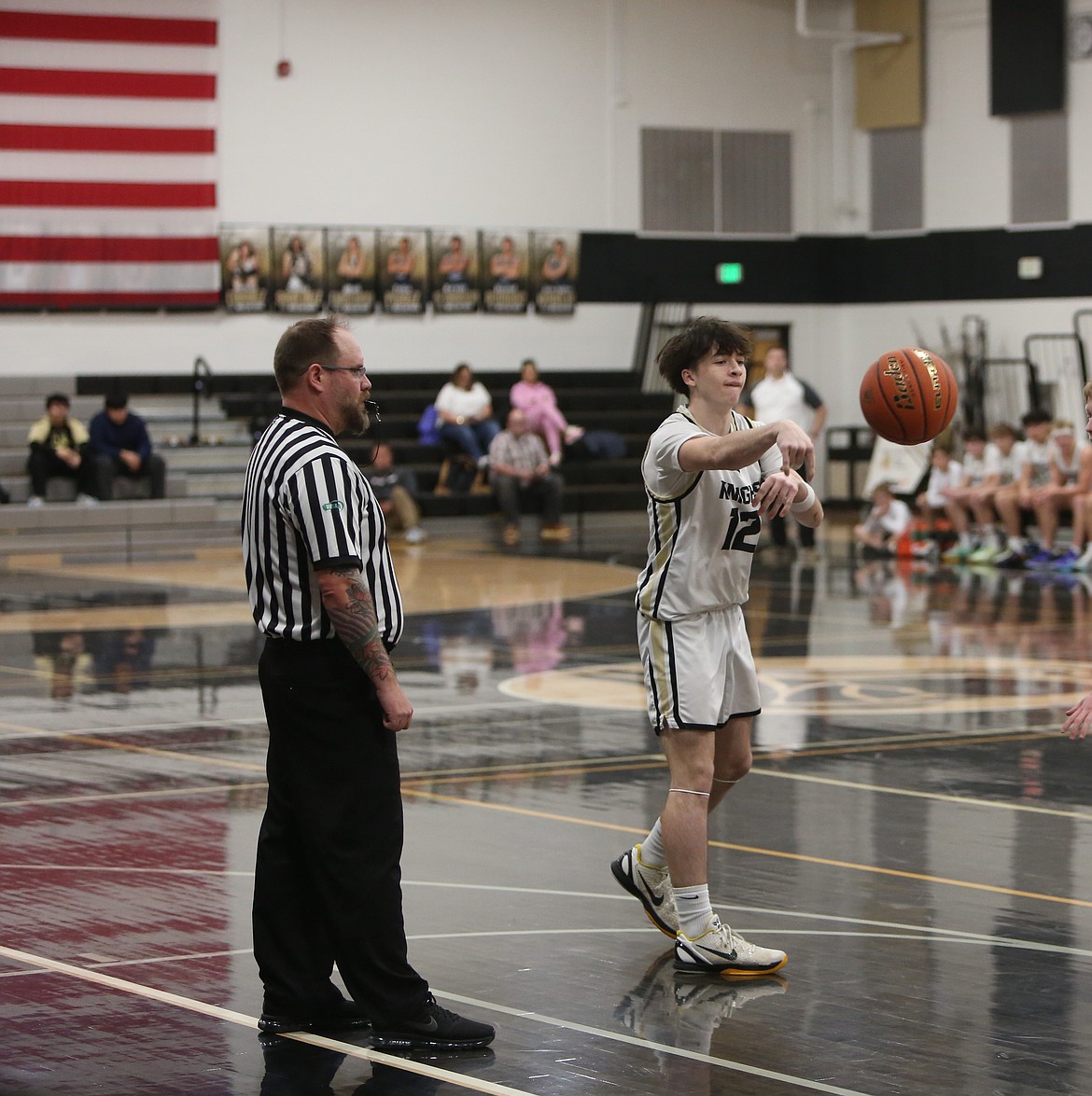 Royal’s Fischer Livingston (12) passes the ball in a league game earlier this season. The Knights advanced to the state quarterfinals with a win Friday.