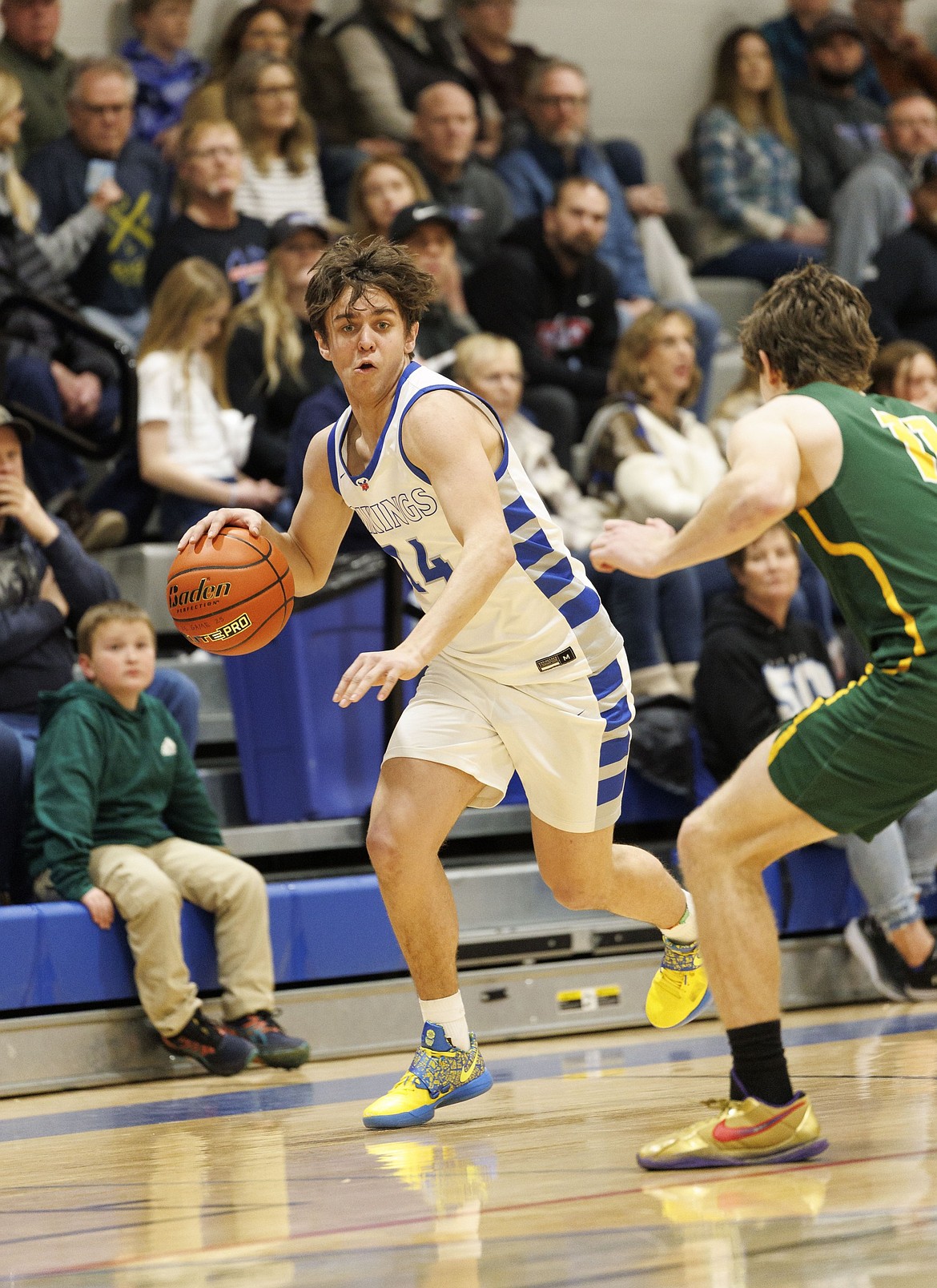 Treker Hickey dodges Whitefish's defense on Thursday, Feb. 27. (Courtesy/Steve Mitchell)