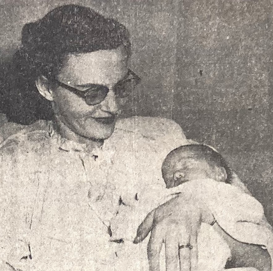 In 1956, Mrs. Thomas Jacobson cuddles her newborn, Ronald.