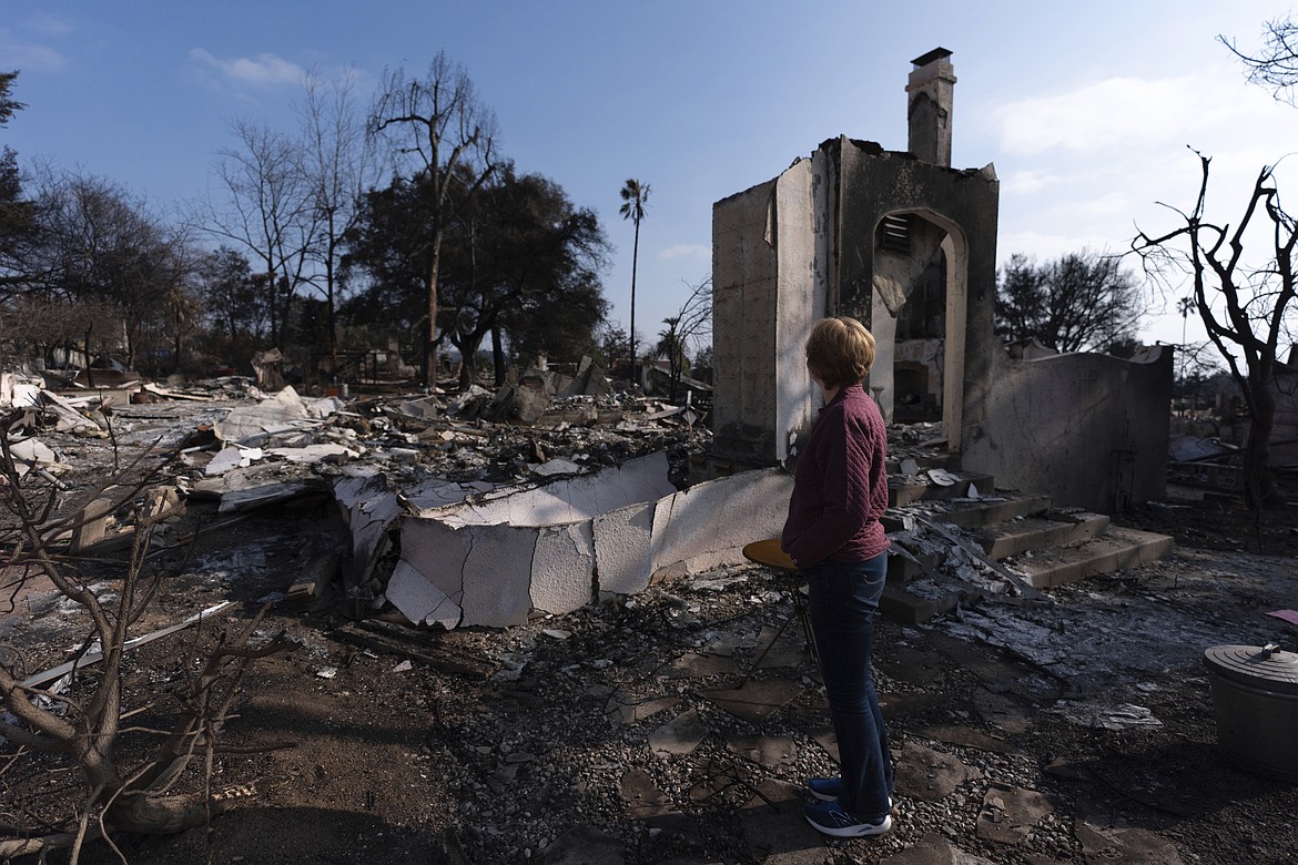Louise Hamlin visits her home ravaged by the Eaton Fire in Altadena, Calif., Thursday, Jan. 30, 2025. (AP Photo/Jae C. Hong, File)