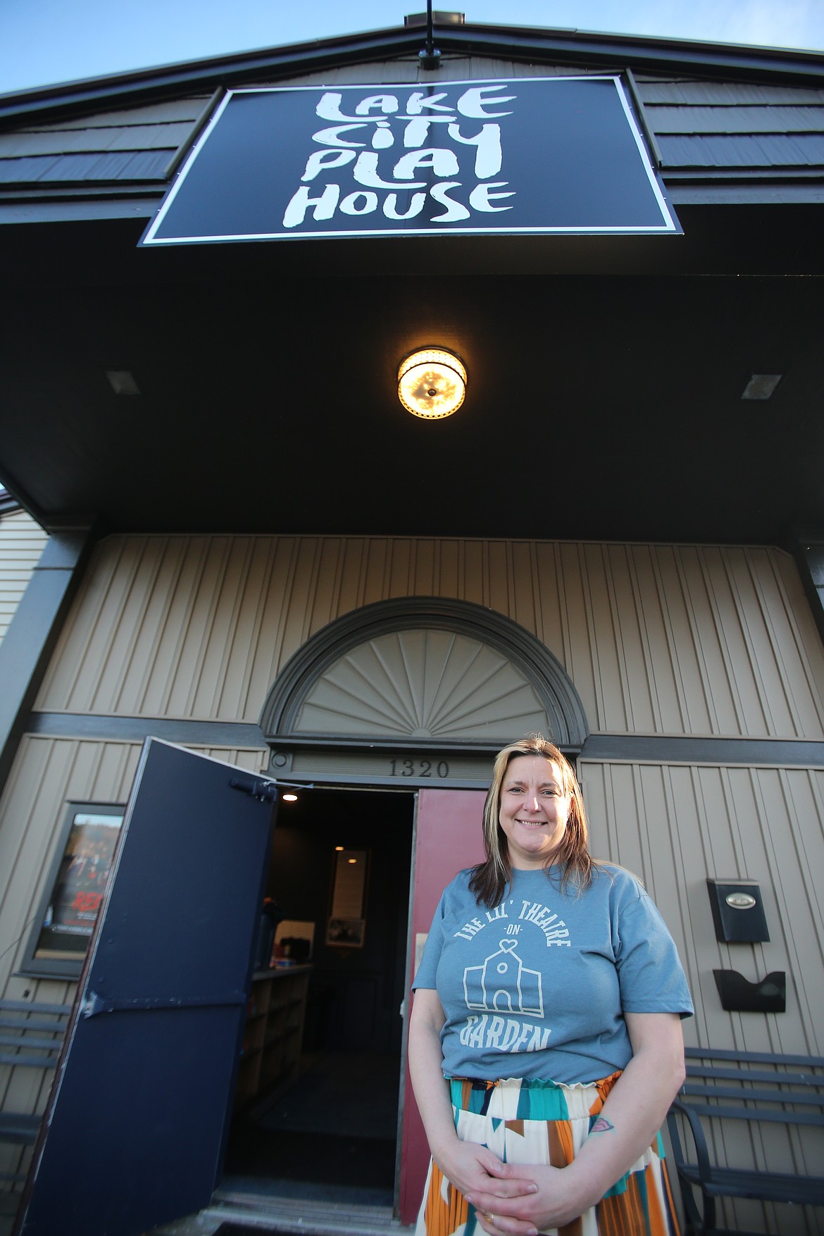 Brooke Wood is officially the artistic director of Lake City Playhouse. She is seen on the steps of the beloved community theater Friday evening.